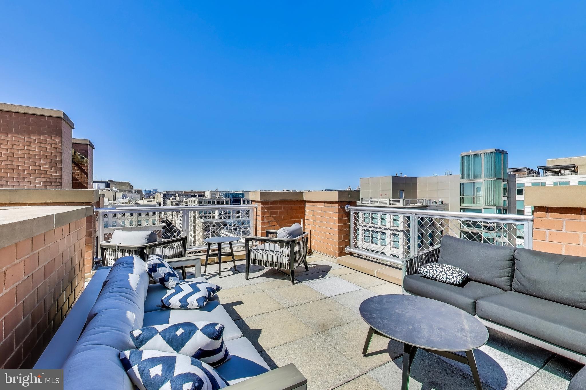 616 E Street Northwest, Unit 648 Washington, DC 20004 - Photo 24 of 39 a view of a terrace with furniture
