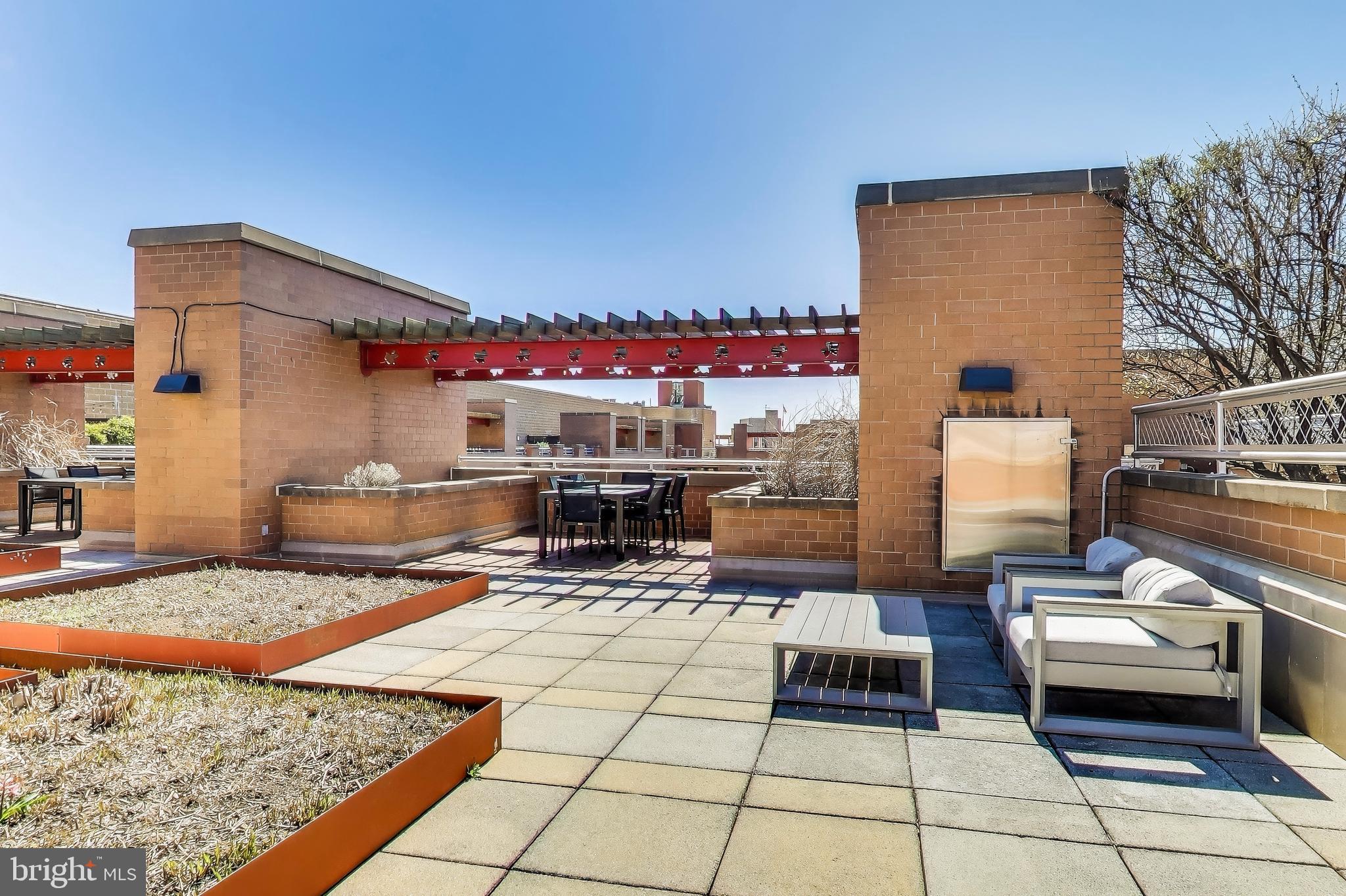 616 E Street Northwest, Unit 648 Washington, DC 20004 - Photo 25 of 39 a living room with a couch and a table