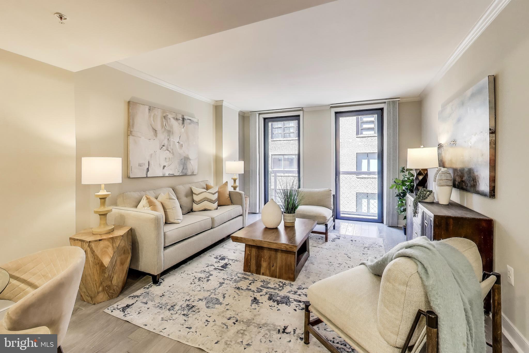 616 E Street Northwest, Unit 648 Washington, DC 20004 - Photo 3 of 39 a living room with furniture and a fireplace