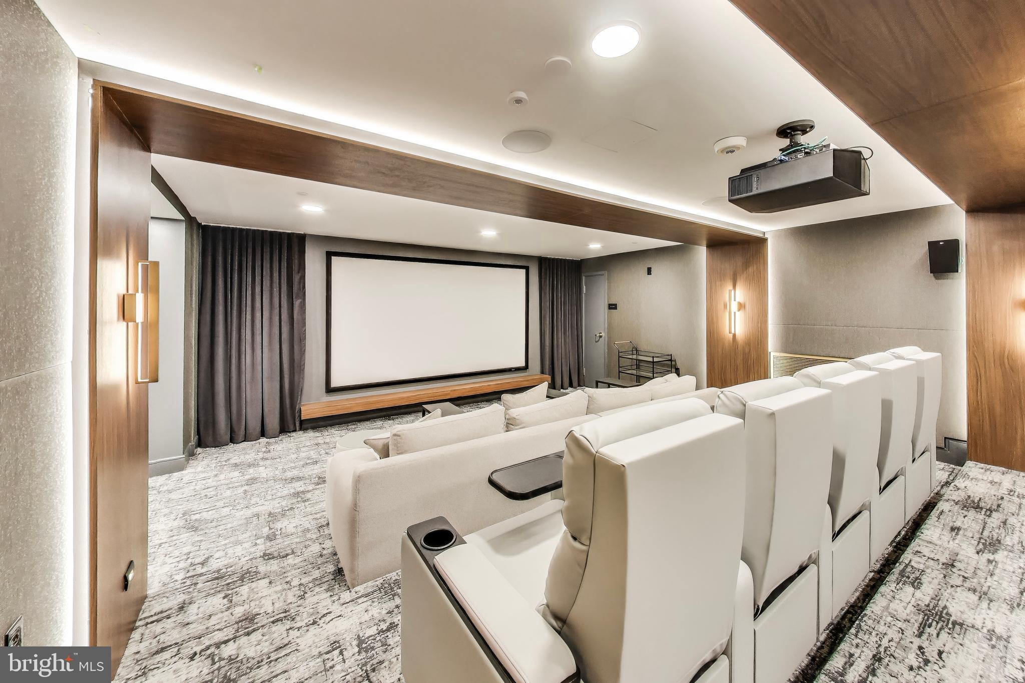 616 E Street Northwest, Unit 648 Washington, DC 20004 - Photo 32 of 39 a living room with furniture and a flat screen tv