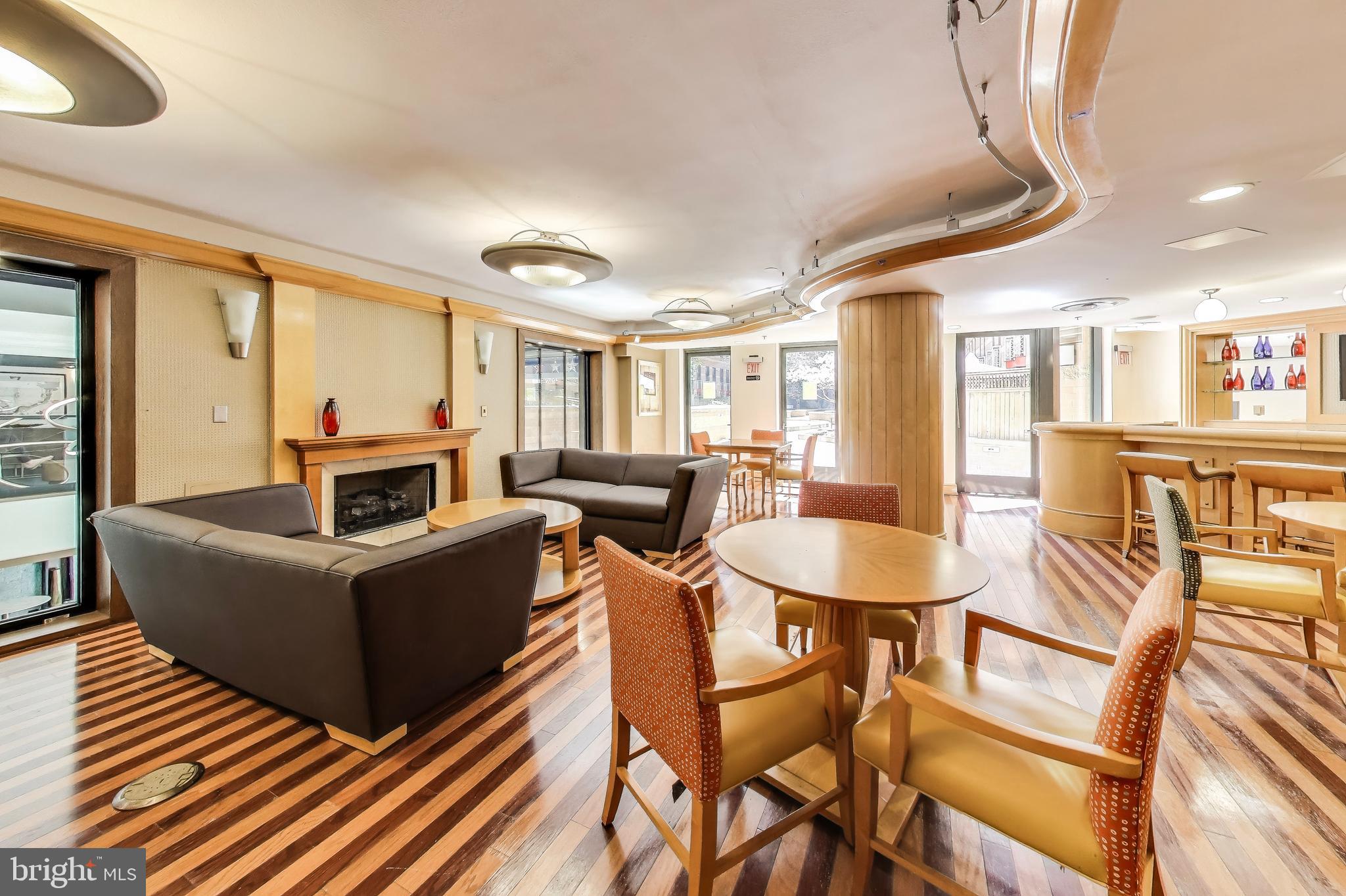 616 E Street Northwest, Unit 648 Washington, DC 20004 - Photo 34 of 39 a living room with furniture and a table