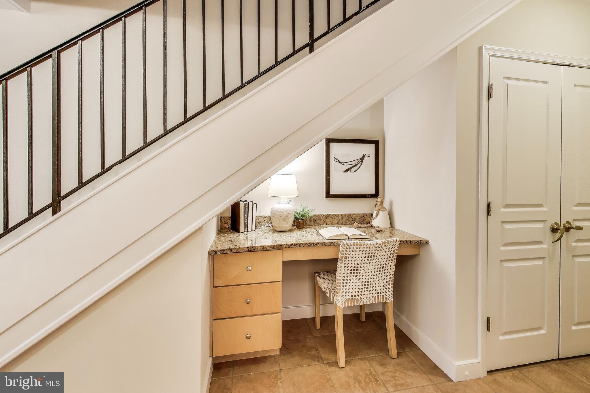 616 E Street Northwest, Unit 648 Washington, DC 20004 - Photo 9 of 39 a room with a table and chairs