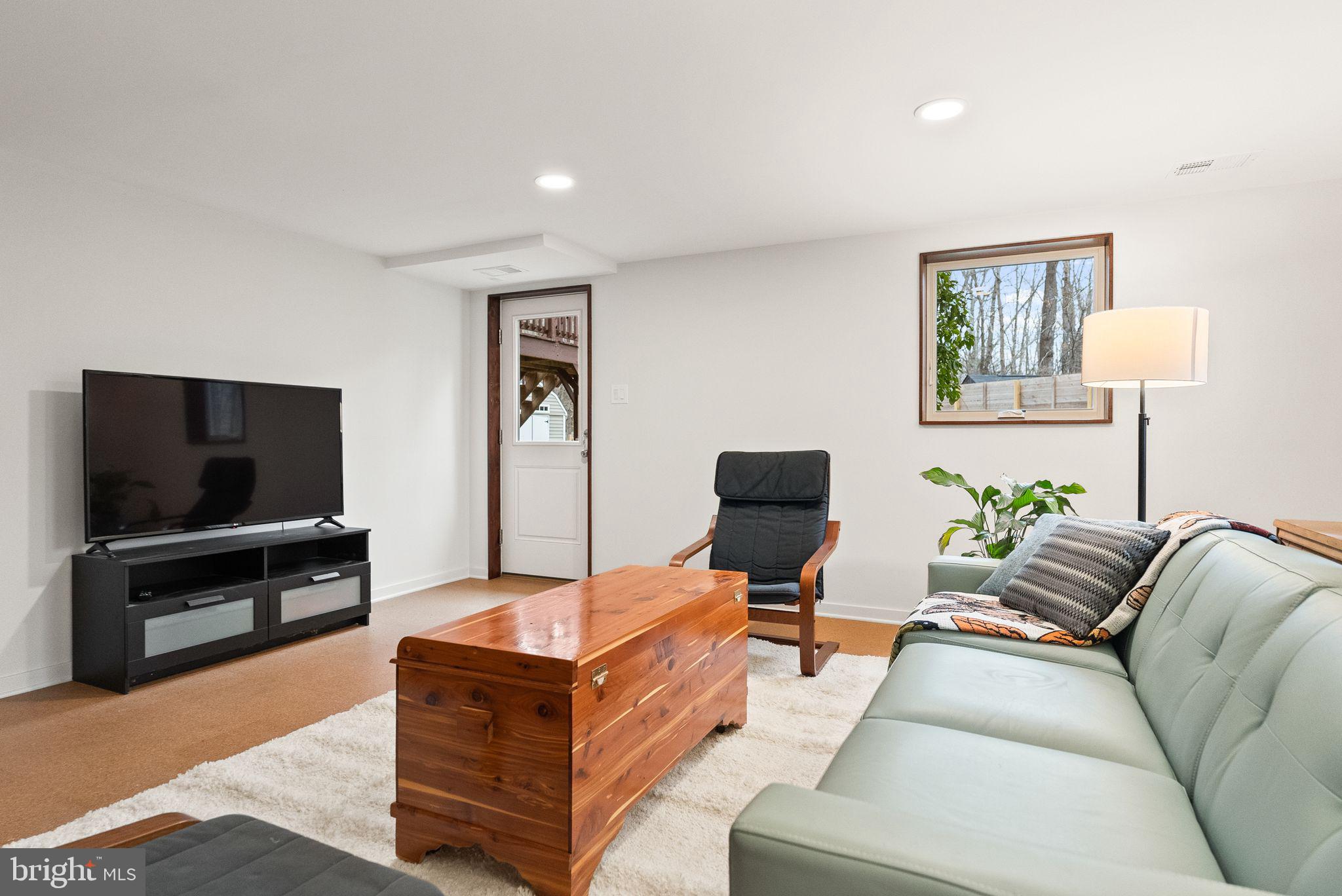 7405 Add Drive Falls Church, VA 22042 - Photo 35 of 74 a living room with furniture and a flat screen tv