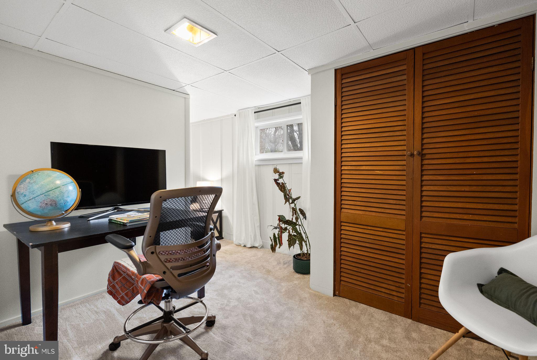 7405 Add Drive Falls Church, VA 22042 - Photo 40 of 74 a view of a workspace with furniture and a window