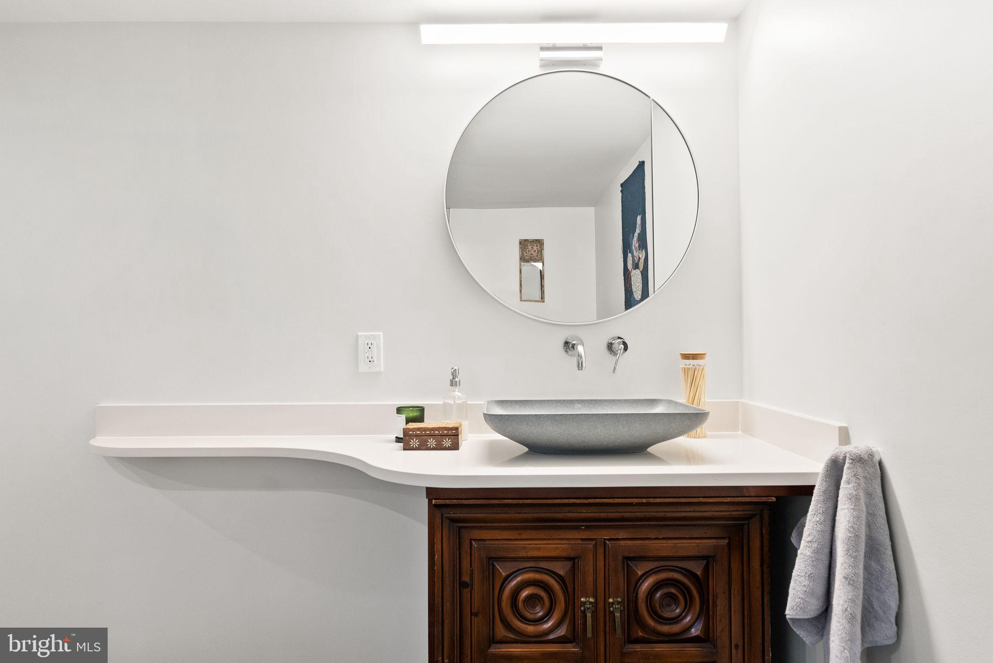 7405 Add Drive Falls Church, VA 22042 - Photo 45 of 74 a bathroom with a sink and a mirror
