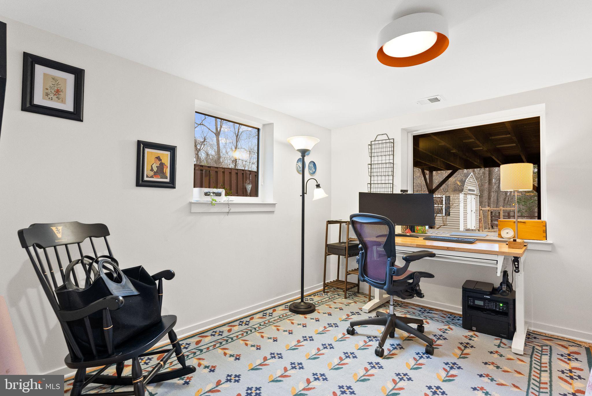 7405 Add Drive Falls Church, VA 22042 - Photo 47 of 74 a view of a workspace with furniture and a window