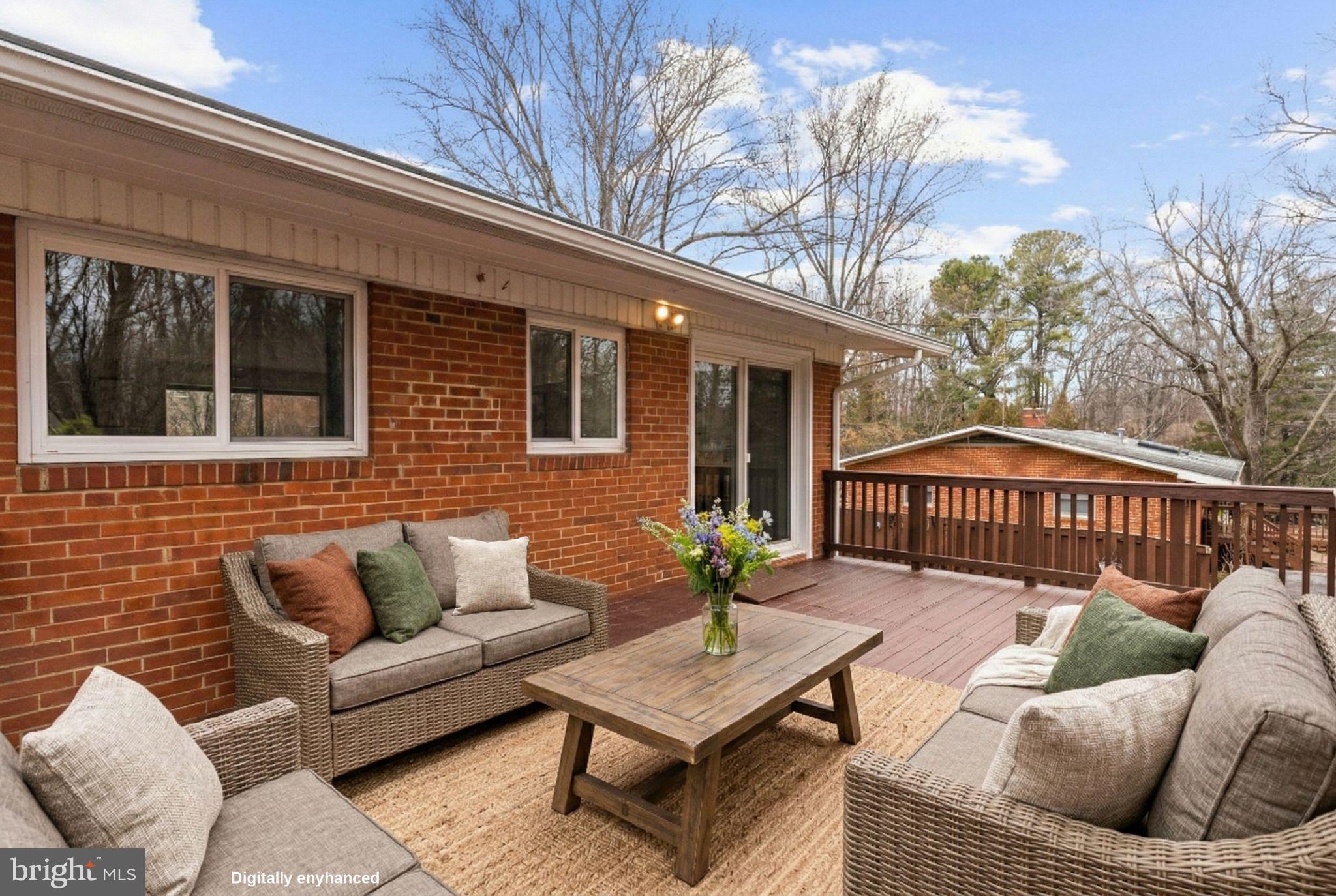 7405 Add Drive Falls Church, VA 22042 - Photo 53 of 74 a view of a patio with couches and a potted plant on a table