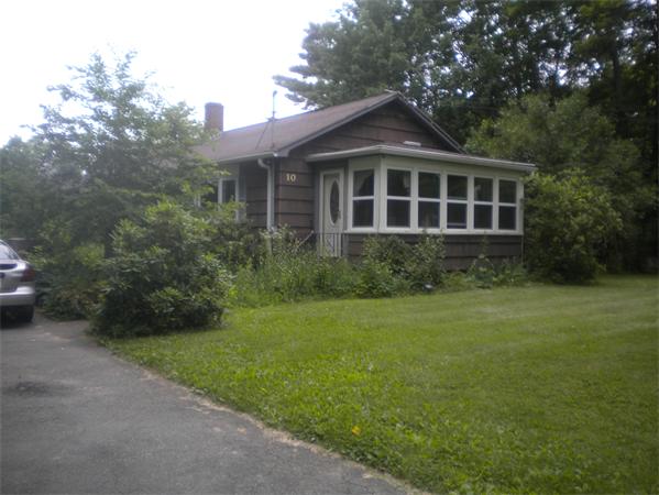 10 Hardwick Road Petersham, MA 01366 - Photo 2 of 4 a front view of a house with garden