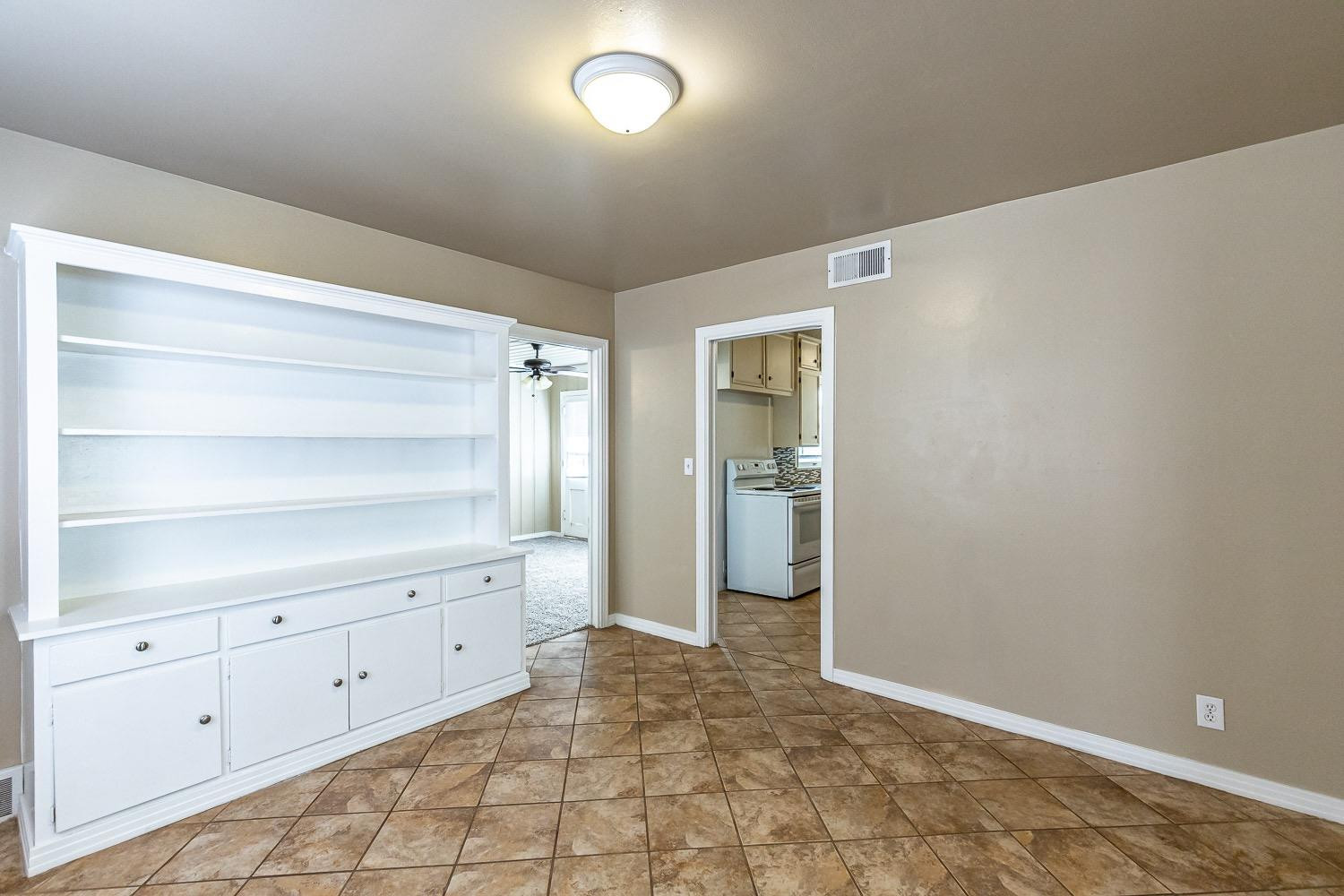 3708 27th Street Lubbock, TX 79410 - Photo 6 of 23 a view of an empty walk in closet