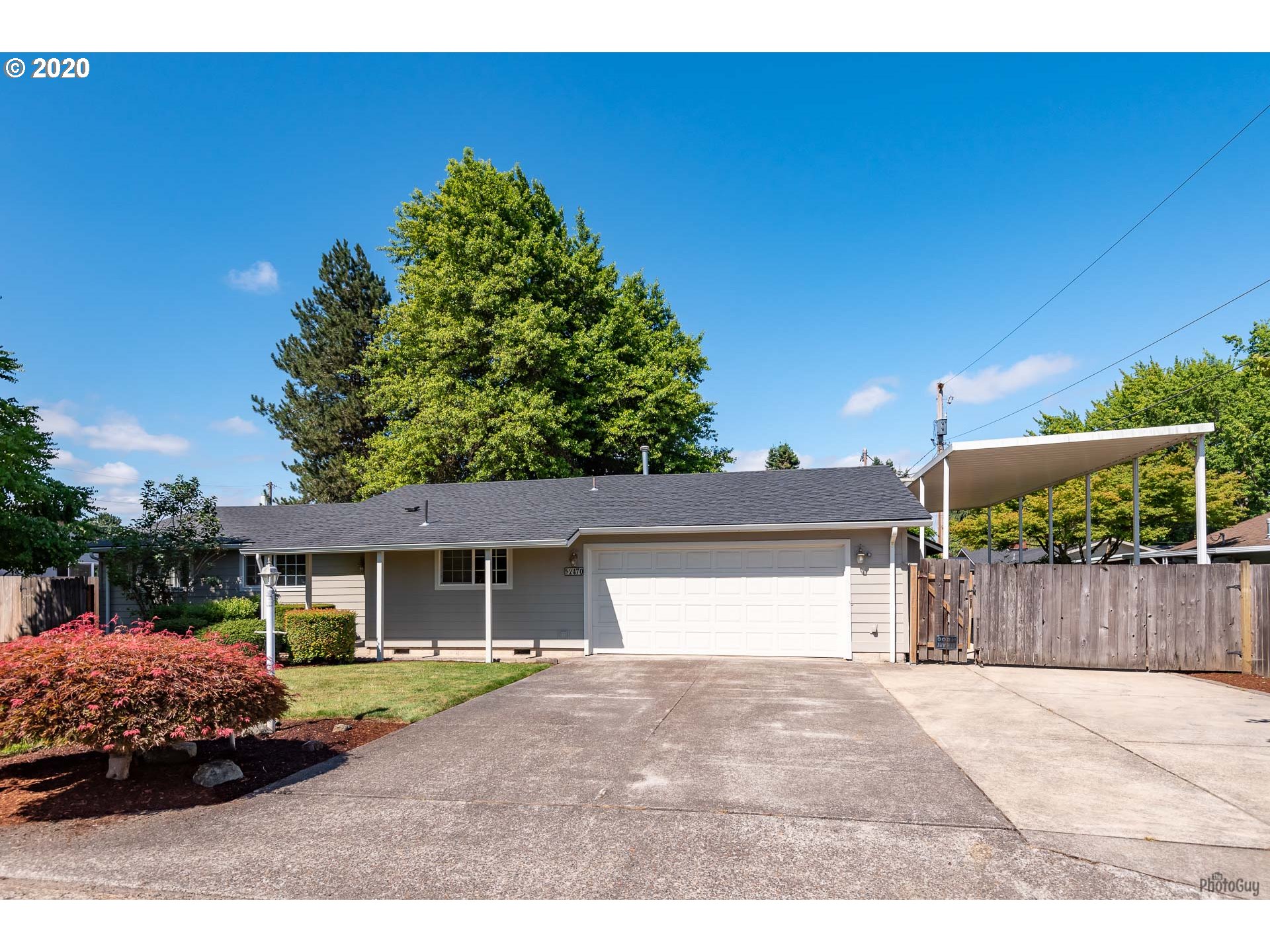 2470 North 14th Place Springfield, OR 97477 - Photo 3 of 32 a house view with a garden space