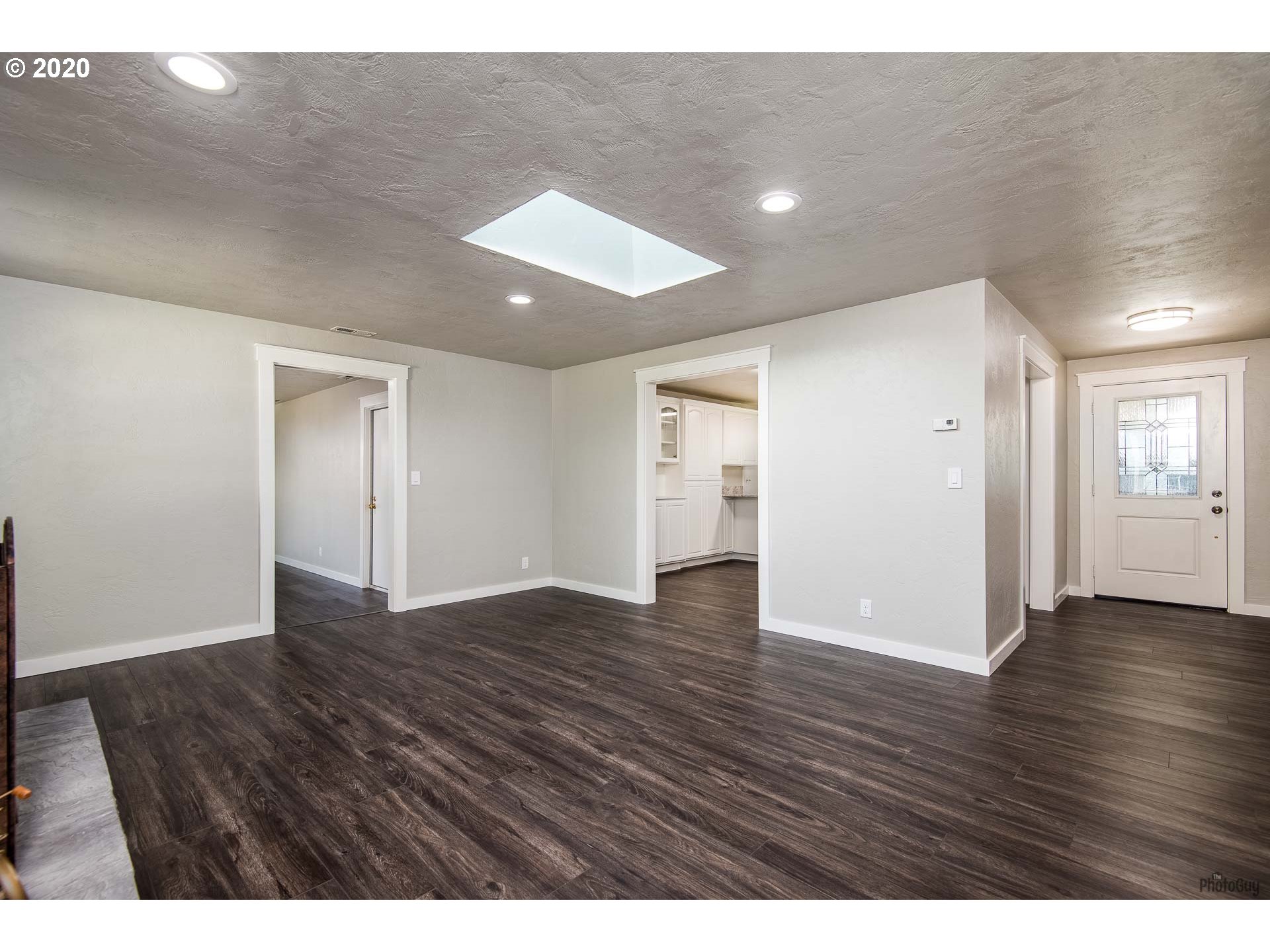 2470 North 14th Place Springfield, OR 97477 - Photo 7 of 32 a view of an empty room with wooden floor and closet