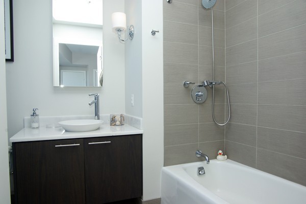 110 Stuart Street, Unit 23G Boston, MA 02116 - Photo 6 of 14 a bathroom with a sink and a mirror