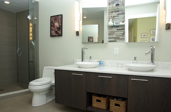 110 Stuart Street, Unit 23G Boston, MA 02116 - Photo 10 of 14 a bathroom with a sink toilet and a mirror
