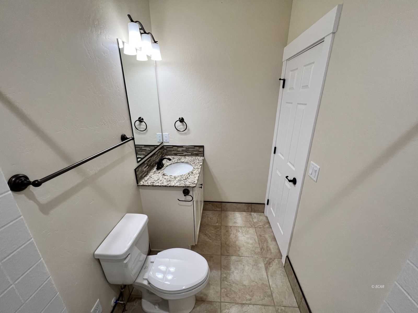 200 Ridgeway Drive Spring Creek, NV 89815 - Photo 20 of 34 a bathroom with a sink a toilet a mirror and vanity