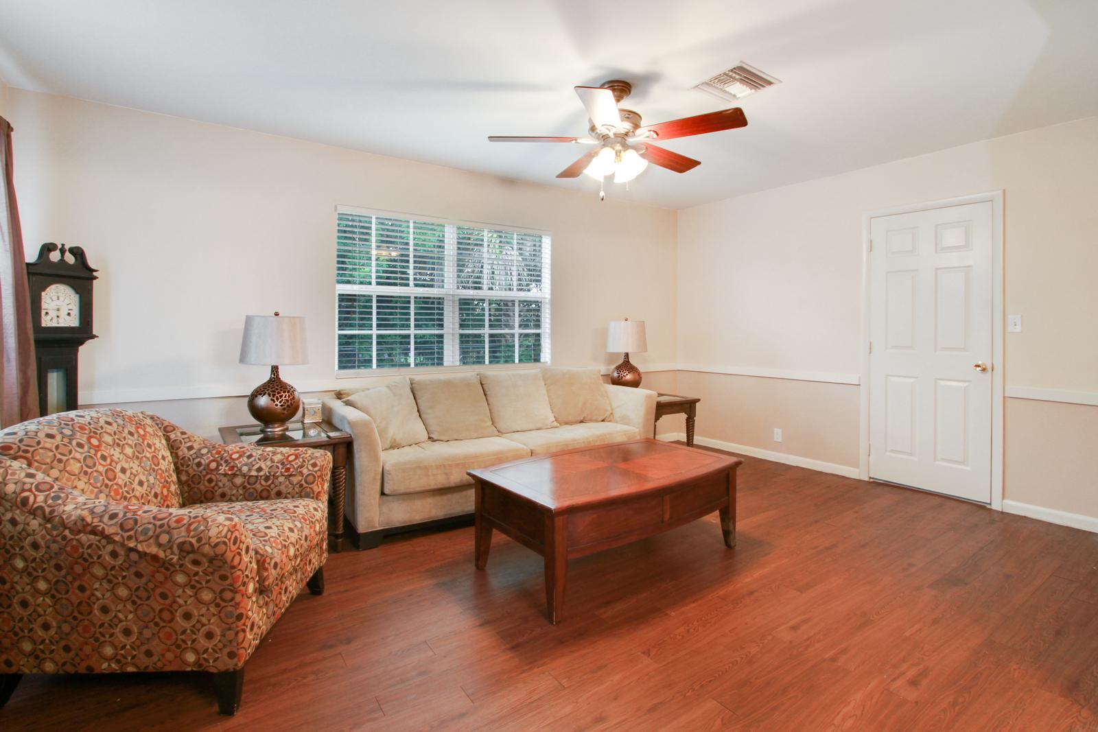 79 Andros Road Palm Springs, FL 33461 - Photo 5 of 11 a living room with furniture and a large window