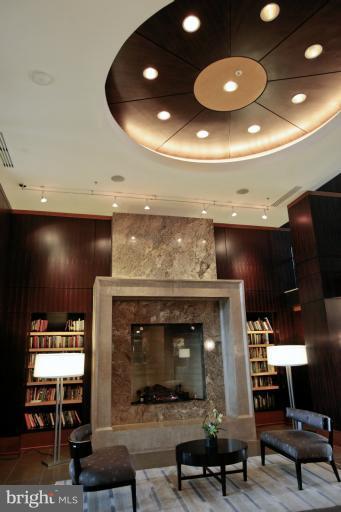 11990 Market Street, Unit 1607 Reston, VA 20190 - Photo 1 of 28 Lobby (fireplace and small library)