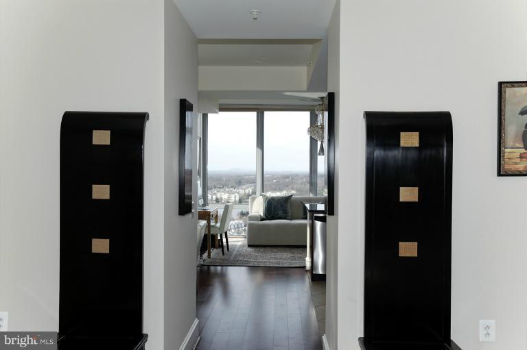 11990 Market Street, Unit 1607 Reston, VA 20190 - Photo 26 of 28 Hallway to kitchen and living room