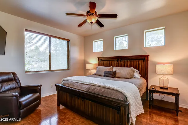 a bedroom with a bed and a couch