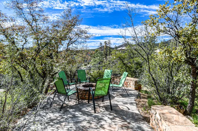 a view of a chairs and table under an umbrella
