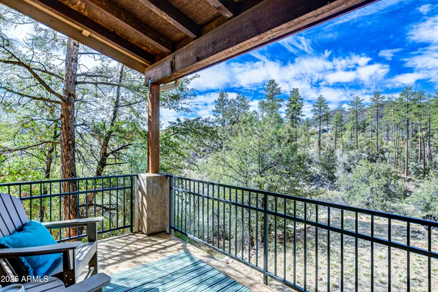 a view of a two chairs in the balcony