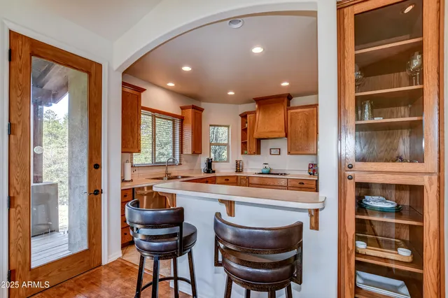 a kitchen with a refrigerator and a sink