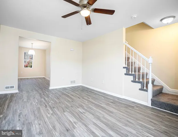 a view of an entryway with wooden floor