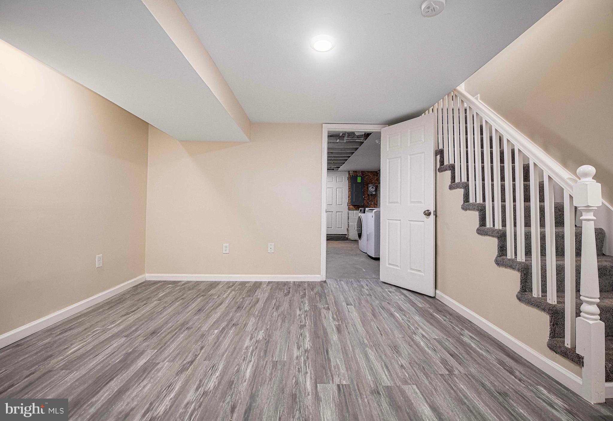 5332 Cuthbert Avenue Baltimore, MD 21215 - Photo 19 of 33 wooden floor in an empty room