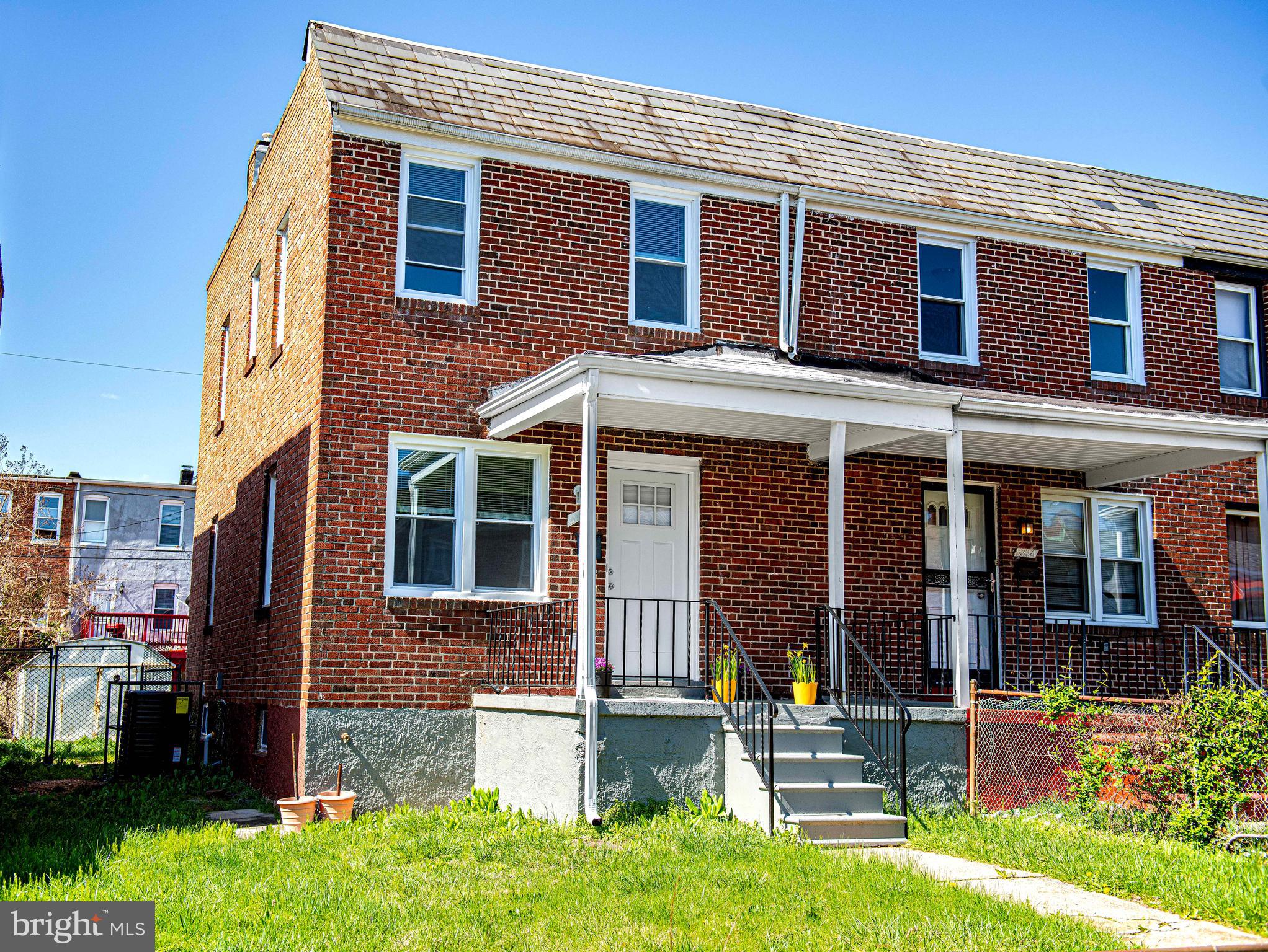 5332 Cuthbert Avenue Baltimore, MD 21215 - Photo 24 of 33 front view of a brick house with a yard
