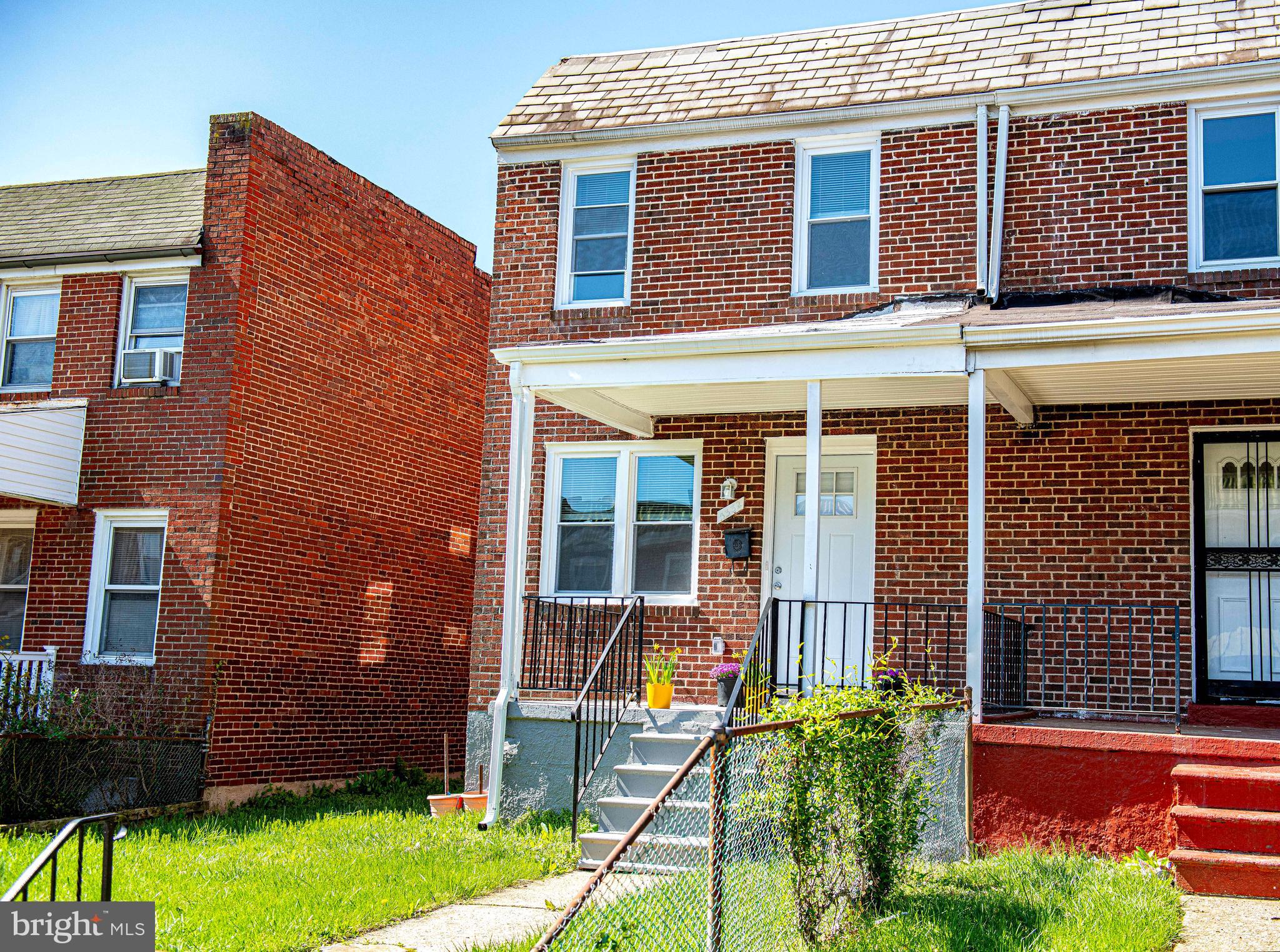 5332 Cuthbert Avenue Baltimore, MD 21215 - Photo 25 of 33 front view of a brick house with a yard