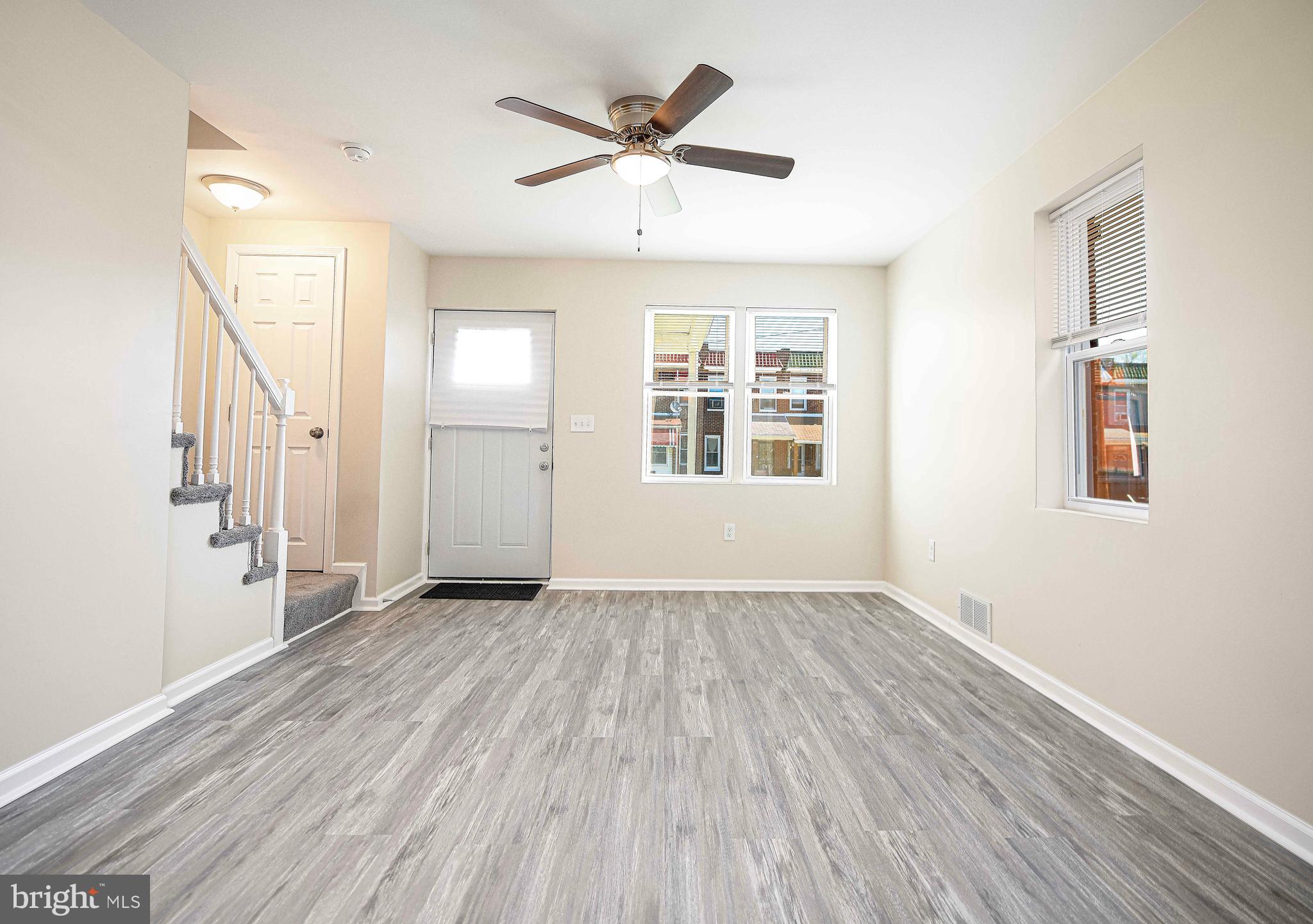 5332 Cuthbert Avenue Baltimore, MD 21215 - Photo 3 of 33 wooden floor in an empty room with a window