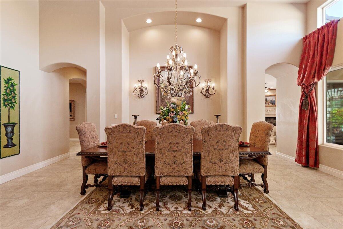 31453 Chimayo Road Thousand Palms, CA 92276 - Photo 14 of 71 a view of a dining room with furniture and chandelier