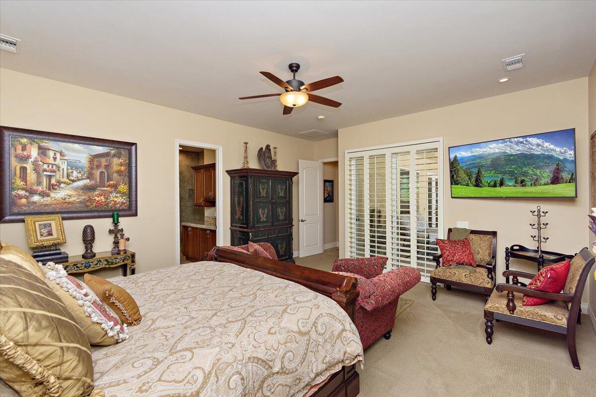 31453 Chimayo Road Thousand Palms, CA 92276 - Photo 19 of 71 a bedroom with a bed and a couch