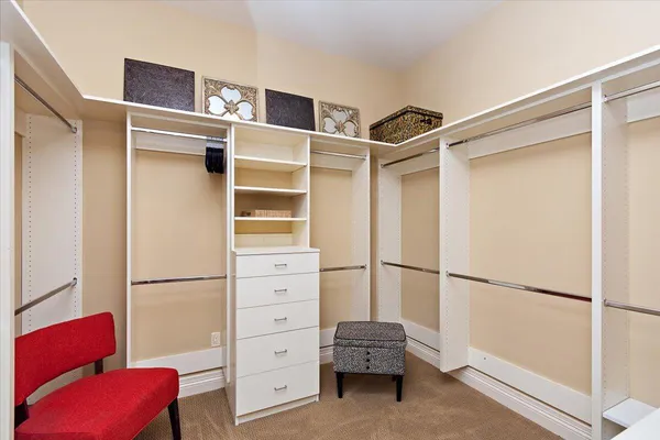 a bedroom with furniture and a flat screen tv