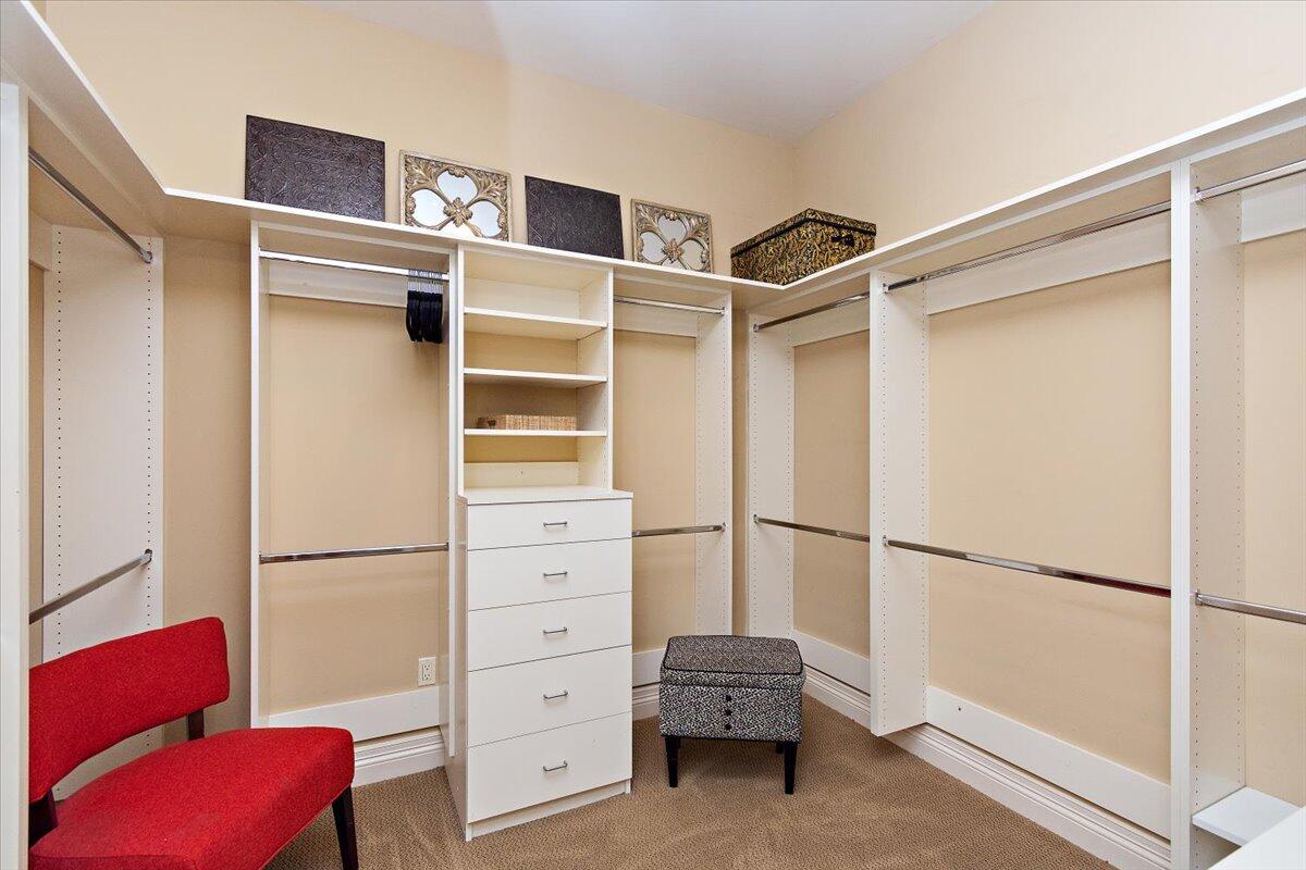 31453 Chimayo Road Thousand Palms, CA 92276 - Photo 24 of 71 a view of walk in closet with clothes and shoes