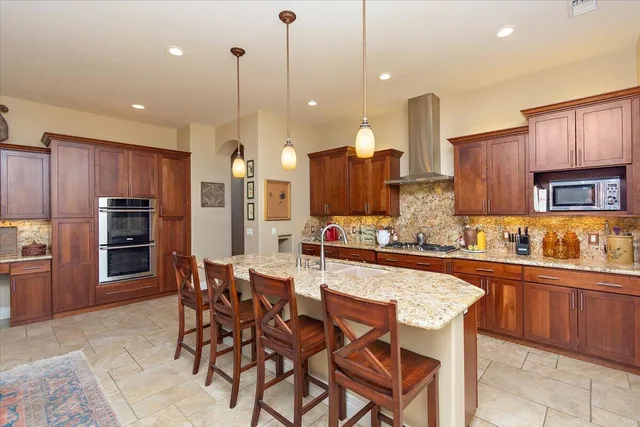 a bathroom with a toilet a sink and a mirror
