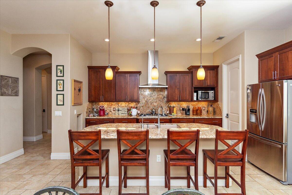 31453 Chimayo Road Thousand Palms, CA 92276 - Photo 29 of 71 a large kitchen with a table and chairs