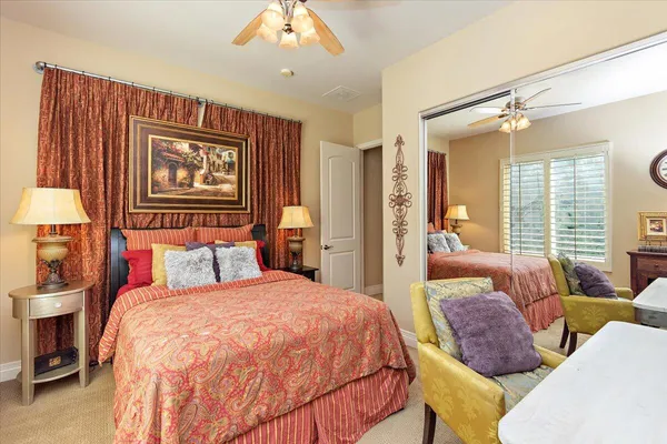 a view of a patio with a table and chairs and potted plants
