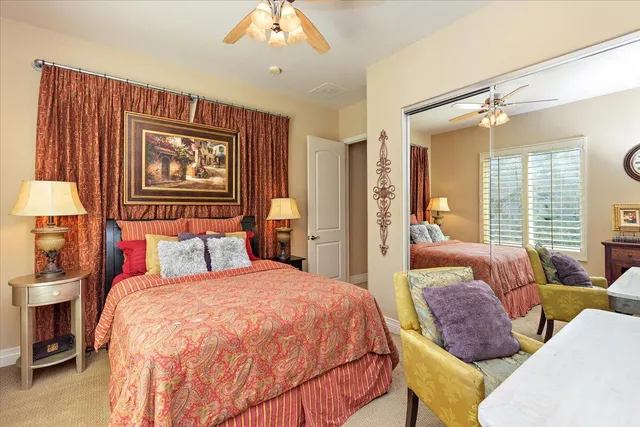 a view of a patio with a table and chairs and potted plants