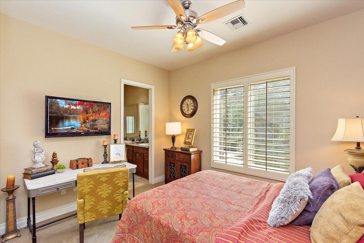 31453 Chimayo Road Thousand Palms, CA 92276 - Photo 35 of 71 a bedroom with furniture and a flat screen tv