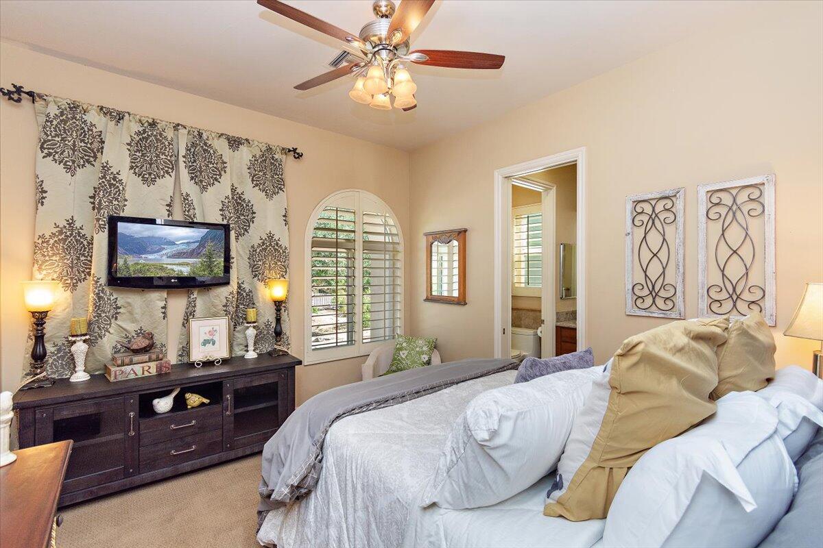 31453 Chimayo Road Thousand Palms, CA 92276 - Photo 37 of 71 a bedroom with a bed and a flat screen tv