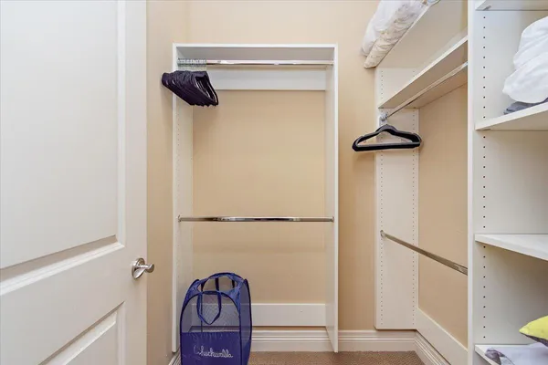 a view of a backyard with chairs and a fire pit