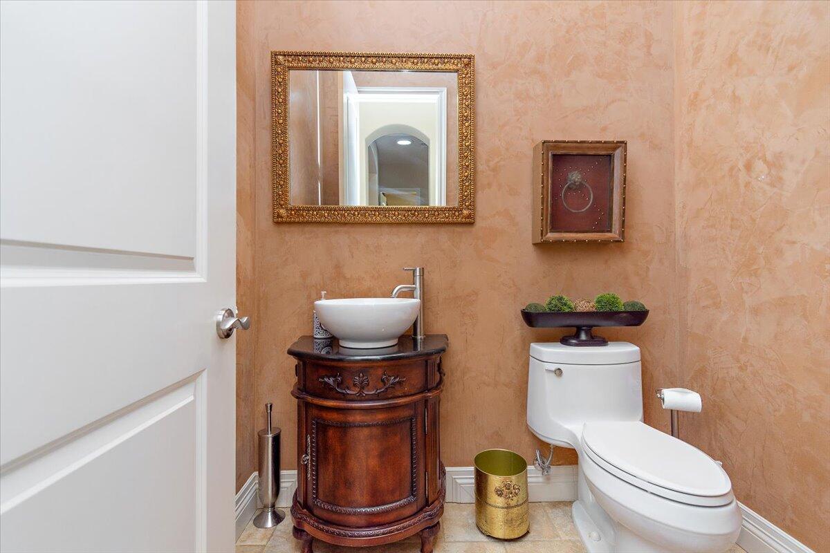 31453 Chimayo Road Thousand Palms, CA 92276 - Photo 40 of 71 a bathroom with a toilet a sink and a mirror