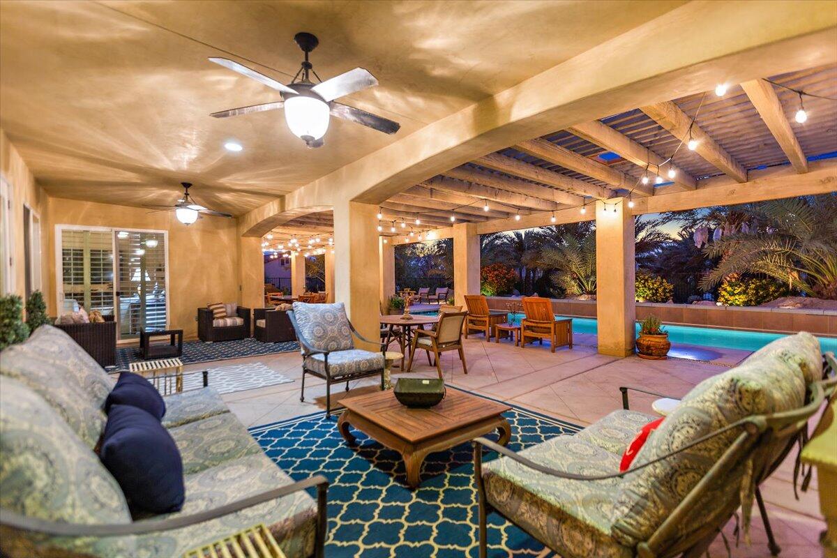 31453 Chimayo Road Thousand Palms, CA 92276 - Photo 46 of 71 a living room with furniture a rug and a large window