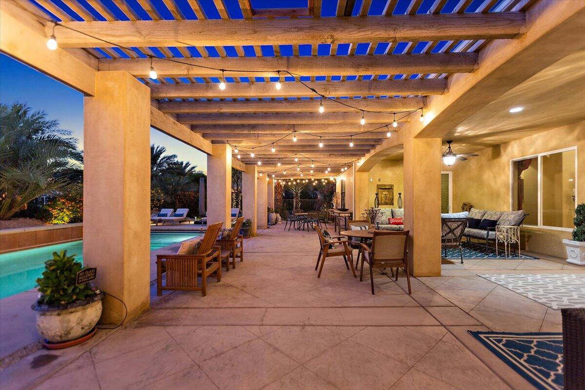 31453 Chimayo Road Thousand Palms, CA 92276 - Photo 47 of 71 a view of a patio with table and chairs potted plants with outdoor seating