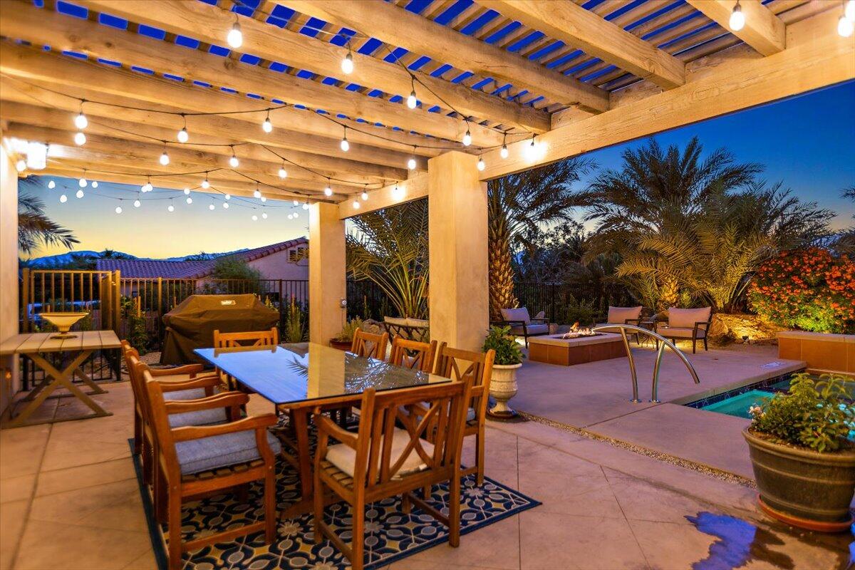 31453 Chimayo Road Thousand Palms, CA 92276 - Photo 48 of 71 a view of a patio with a table and chairs and potted plants