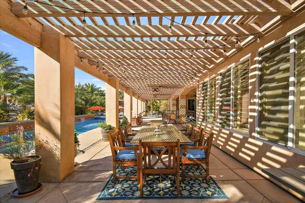 a swimming pool with outdoor seating and yard