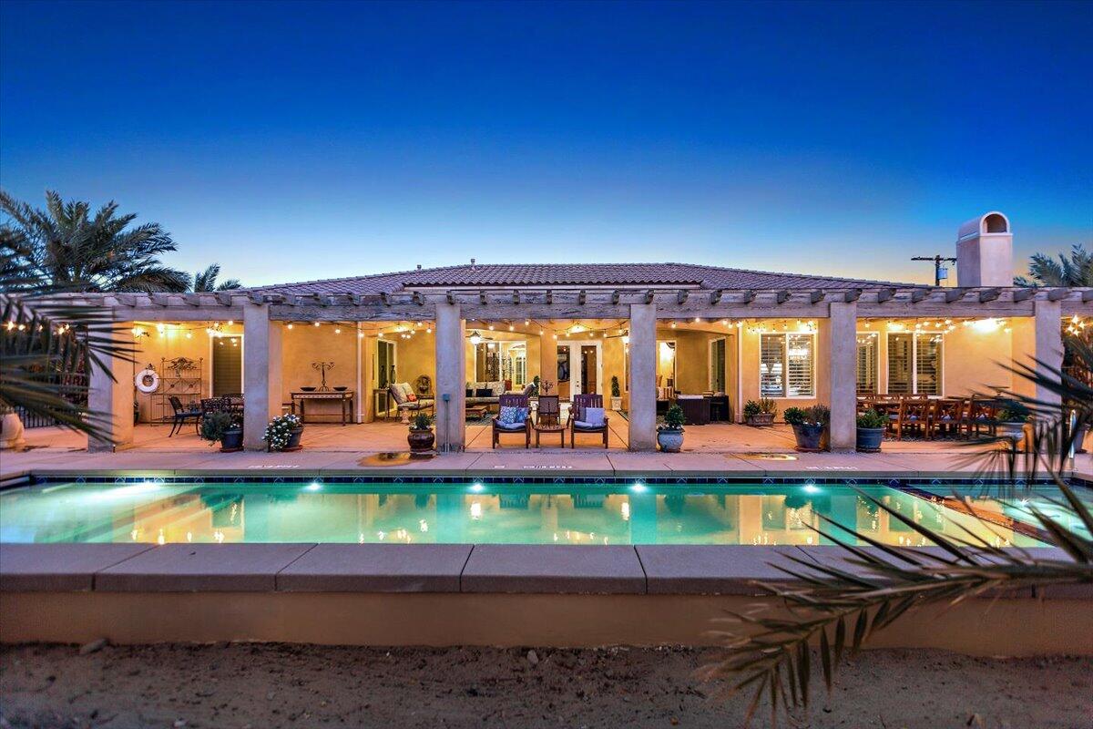 31453 Chimayo Road Thousand Palms, CA 92276 - Photo 5 of 71 a view of a swimming pool with outdoor seating