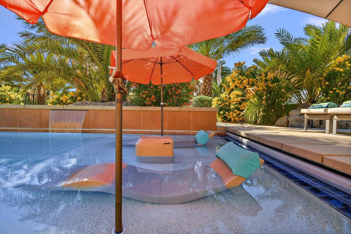 31453 Chimayo Road Thousand Palms, CA 92276 - Photo 54 of 71 a view of a backyard with chairs and a fire pit