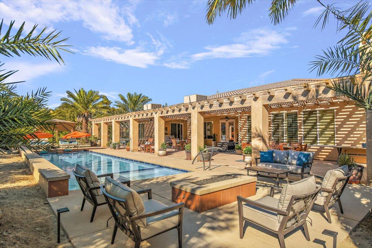 31453 Chimayo Road Thousand Palms, CA 92276 - Photo 57 of 71 a view of a patio with couches table and chairs and potted plants