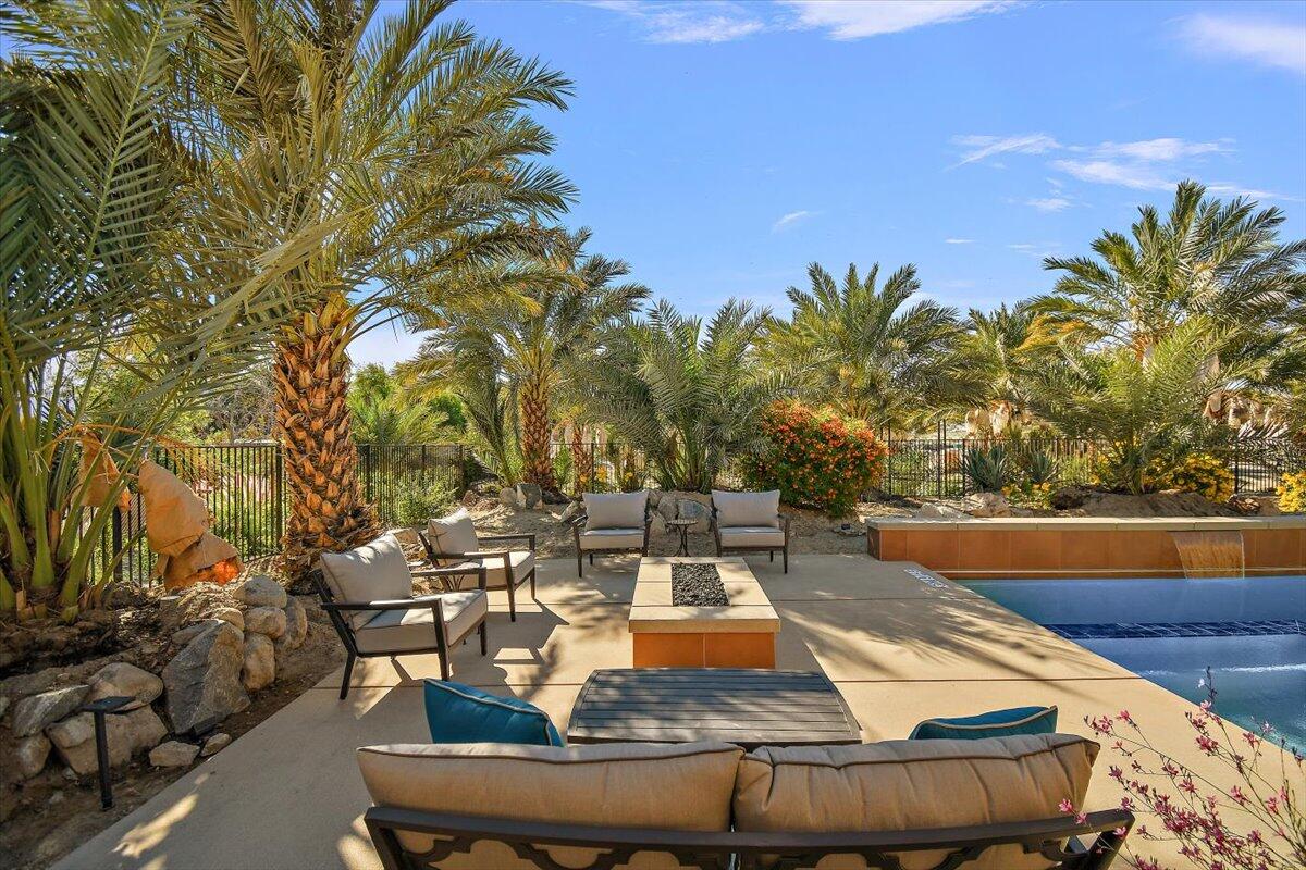 31453 Chimayo Road Thousand Palms, CA 92276 - Photo 61 of 71 a view of a swimming pool with lounge chairs